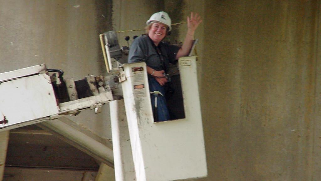 澳门足彩app's Sue Tryon working in the field.