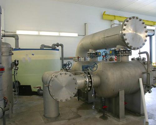 Large pipes inside the facility at the SMRU 水 Treatment Facility