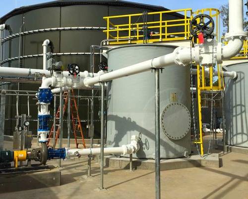 Exterior photo of Greenfield Biologics Facility process tanks and piping